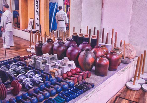 The Goju Ryu "toolbox." This photograph, taken at the Higaonna Dojo in Tsuboya, Okinawa, demonstrates the importance that senior Goju Ryu practitioners place in body conditioning and strengthening. This is a vital part of the legacy of Chojun Miyagi, and something that shouid be part of every karateka's training regime.